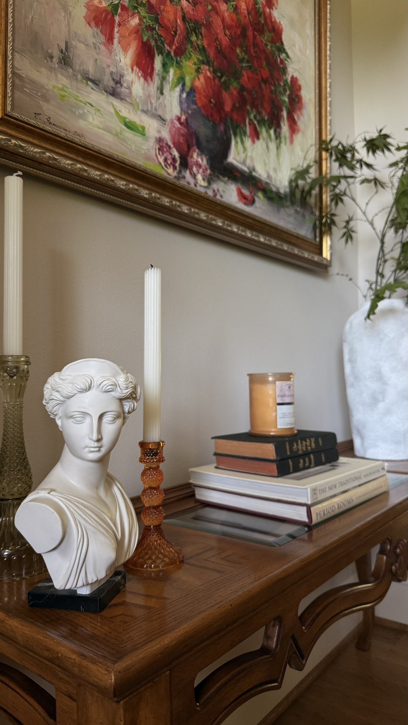 Collected art, books, sculpture, and objects styled by Christina D. Interiors
